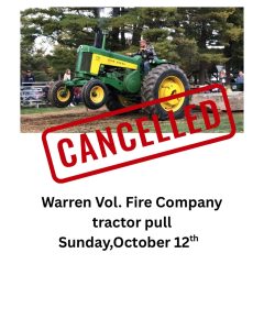 A person drives a green John Deere tractor in a tractor pull event. Overlaid is a large red "CANCELLED" stamp. Text below says: “Warren Vol. Fire Company tractor pull, Sunday, October 12th.”.
